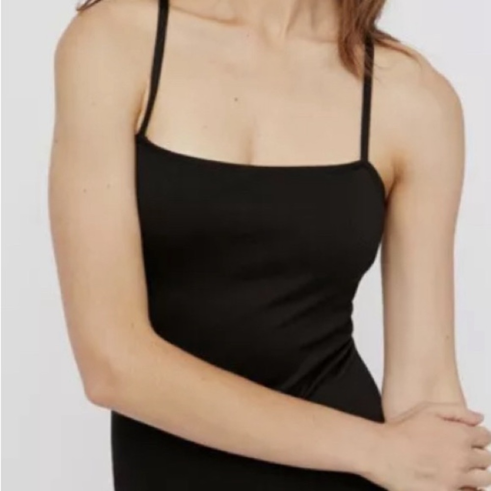 Free People NWOT black body suit never worn